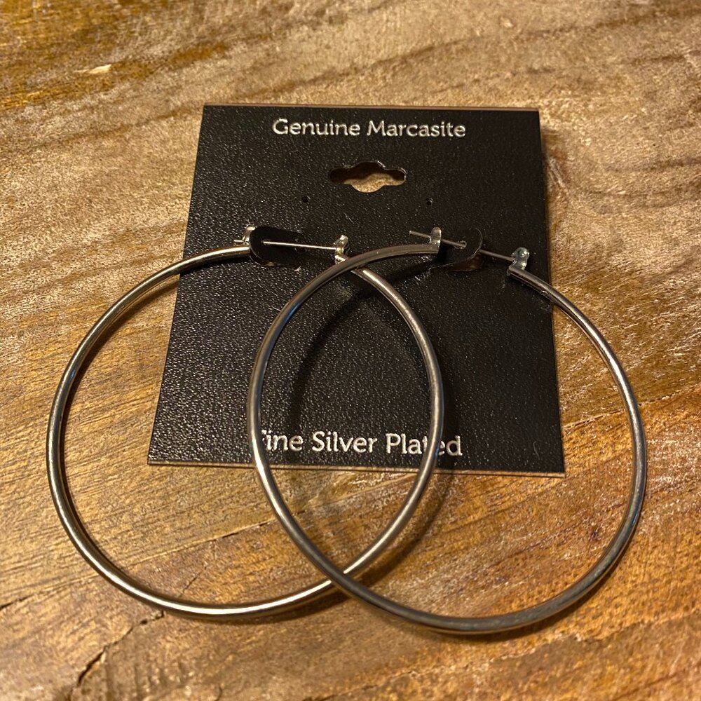 For sale large basic/classic  hoop polished silver tone earrings